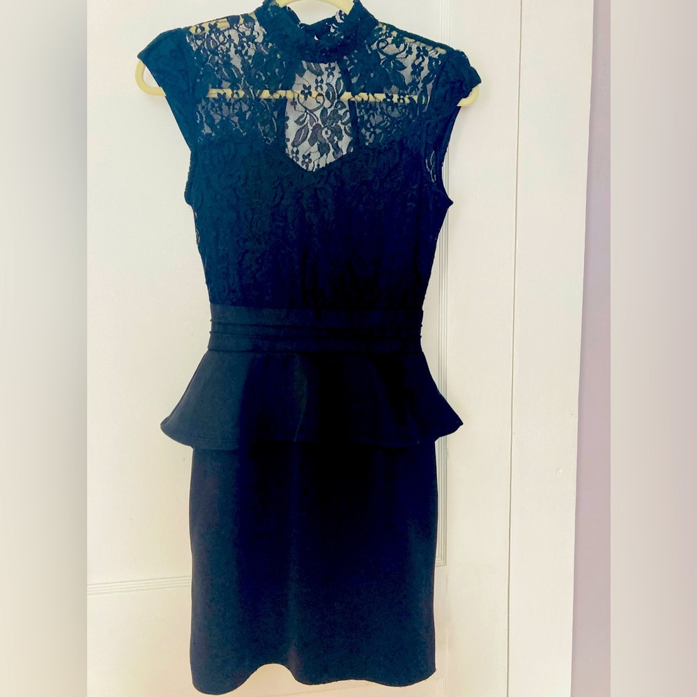Flattering cocktail pencil dress. Peplum/Ruffle waist design.